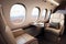 Private jet interior features plush leather seats, spacious cabin, large windows, high-end finishes, and a table.