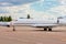 Private jet on the runway. Jet airplane stop for wait VIP passenger on runway