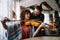 Private male music teacher giving violin lessons to a woman at home