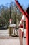 Private road closed with red and white automatic security barrier gate. Automated closure with street sign warning barriers closed