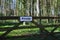 Private sign on gate in woodland setting.