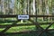 Private sign on gate in woodland setting.