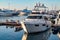 Private snow-white yacht in the parking lot near the Sochi sea station at sunset, surrou