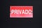 Private, Spainsh word `privado`, on a red plate.