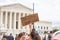 Pro Choice Protester Holding Up A Sign Outside The Supreme Court