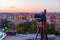 Pro dslr on tripod in evening roof photoshoot