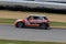 Pro MINI Cooper race car on the course