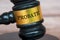 Probate text engraved on gavel with blurred wooden cover background. Legal and law concept