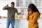 Problems In Relationship. Black Couple Arguing In Kitchen, Man Shouting At Girlfriend
