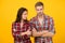 Problems in relationship. couple break up. family psychology. man and woman checkered shirt. serious students yellow