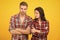 Problems in relationship. couple break up. family psychology. man and woman checkered shirt. serious students yellow