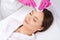 A procedure for cleansing the skin of the face from blackheads and acne. Cosmetologist treats problematic skin of a young woman`s