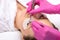 A procedure for cleansing the skin of the face from blackheads and acne. Cosmetologist treats problematic skin of a young woman`s