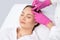 A procedure for cleansing the skin of the face from blackheads and acne. Cosmetologist treats problematic skin of a young woman`s