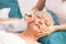 Procedure of facial rejuvenation for senior woman