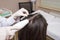 Procedure of mesotherapy. The doctor cosmetologist makes the procedure of mesotherapy in woman`s head. Strengthen hair
