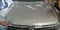 Process of armoring car hood with transparent polyurethane anti-gravel film cover coating or PPF in car detailing studio