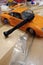 The process of assembling and painting the scale model of the car. Orange sports car in miniature. Manual mini drill
