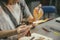 The process of blowing glass products. The manufacture of beads. Hands in the frame. Selective soft focus.