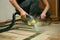 The process of cleaning carpets with a steam vacuum cleaner.