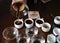 The process of coffee cupping. Coffee is poured into tasting cups