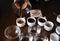 The process of coffee cupping. Coffee is poured into tasting cups