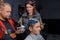 The process of color professional stylish fashion hair coloring for a young client, a guy at work, in a barbershop or hairdresser