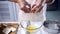 Process of cooking delicious homemade cake. Woman preparing and mixing ingredients for sweet food dessert in kitchen