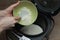 The process of cooking rice porridge in multicooker closeup