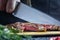 The process of cutting a steak into pieces close-up. Beef steak medium rare