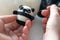 Process of felting a toy panda from a white and black wool