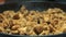 Process of frying chopped chicken pieces. Close-up