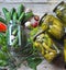 The process of home canning cucumbers in glass jars under lids for storage for the winter.Jars of cucumbers on a wooden background