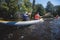 A process of kayaking in the city river canals, with colorful canoe kayak boat paddling, process of canoeing, group of kayaks