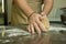 The process of making bread. The chef kneads the dough by hand