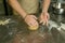 The process of making bread. The chef kneads the dough by hand