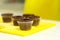 The process of making chocolate cupcakes with sweet cream. Creation of cakes by professional pastry chefs