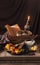 Process of making cookies for the celebration of Halloween. Pumpkin pieces, sugar, yolks and spices. Still life in dark colors.