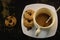 the process of making flat white coffee by pouring steam milk into a cup of espresso, served with low-fat biscuits so that you