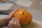 The process of making a Halloween pumpkin. drawing a layout. horror theme and Hallowe`en