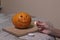 The process of making a Halloween pumpkin. light a match and candle. horror theme and Hallowe`en