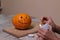 The process of making a Halloween pumpkin. light a match and candle. horror theme and Hallowe`en