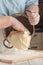 The process of making home bread by male hands