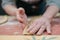 The process of making homemade Italian pasta. Italian woman preparing homemade pasta in the kitchen, close-up on hands. Different