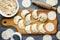 Process of making ravioli, pelmeni or dumplings with chicken meat on kitchen table