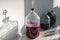 The process of making red homemade wine. A 20 liter glass bottle with an airlock in a cork.