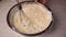 Process of making and whisking the dough, woman`s hand mixing liquid dough