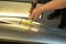 Process Of Paintless Dent Repair On Car Body. Technician s Hands With Puller Fixing Dent On Rear Car Fender. PDR Removal