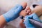 Process pedicure close-up, polishing feet, unrecognizable people. blurred face.