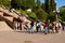 The process of photographing little children near the stairs to the embankment of Ternopil Lake